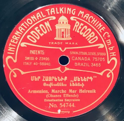 A red and black record with the words " international talking machine company ".